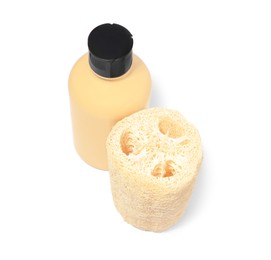 New loofah sponge and bottle of cosmetic product on white background
