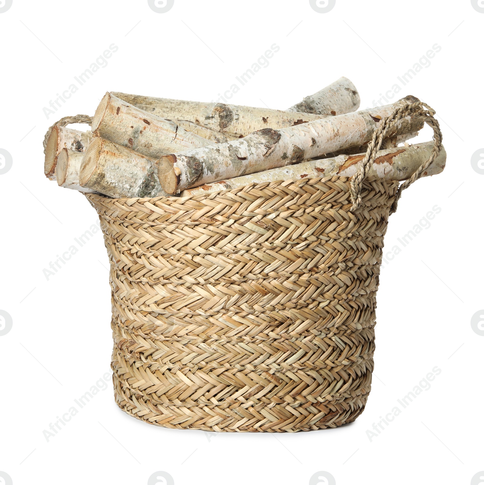 Photo of Wicker basket with cut firewood isolated on white