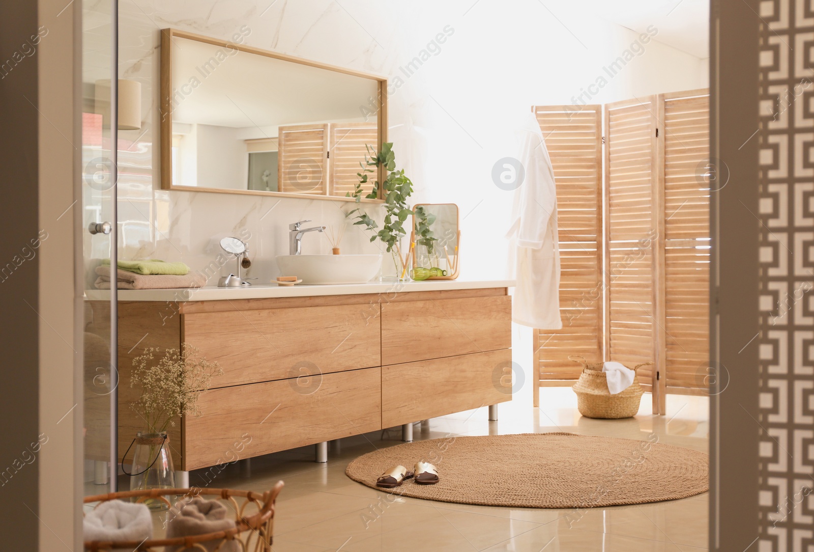 Photo of Modern bathroom interior with vessel sink and big mirror