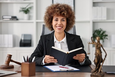 Notary with notebook at workplace in office