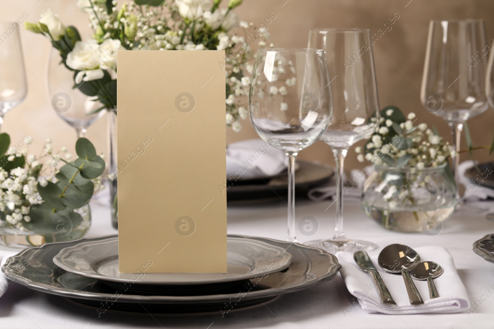 Photo of Stylish elegant table setting for festive dinner in restaurant