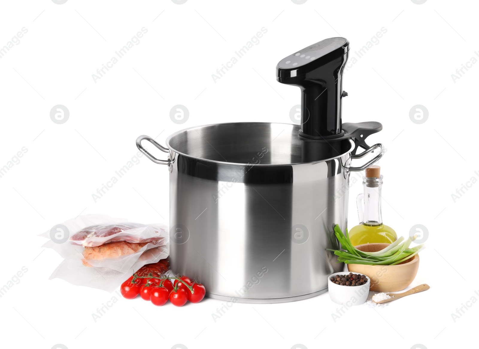 Photo of Thermal immersion circulator in pot and ingredients on white background. Sous vide cooking