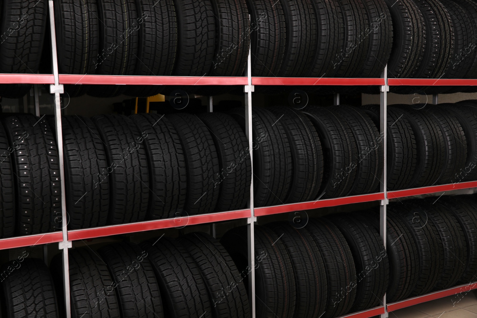 Photo of Car tires on rack in auto store