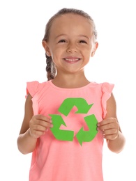 Photo of Little girl with recycling symbol on white background