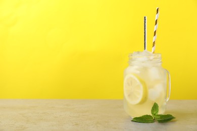 Photo of Natural lemonade with mint on light grey table, space for text. Summer refreshing drink