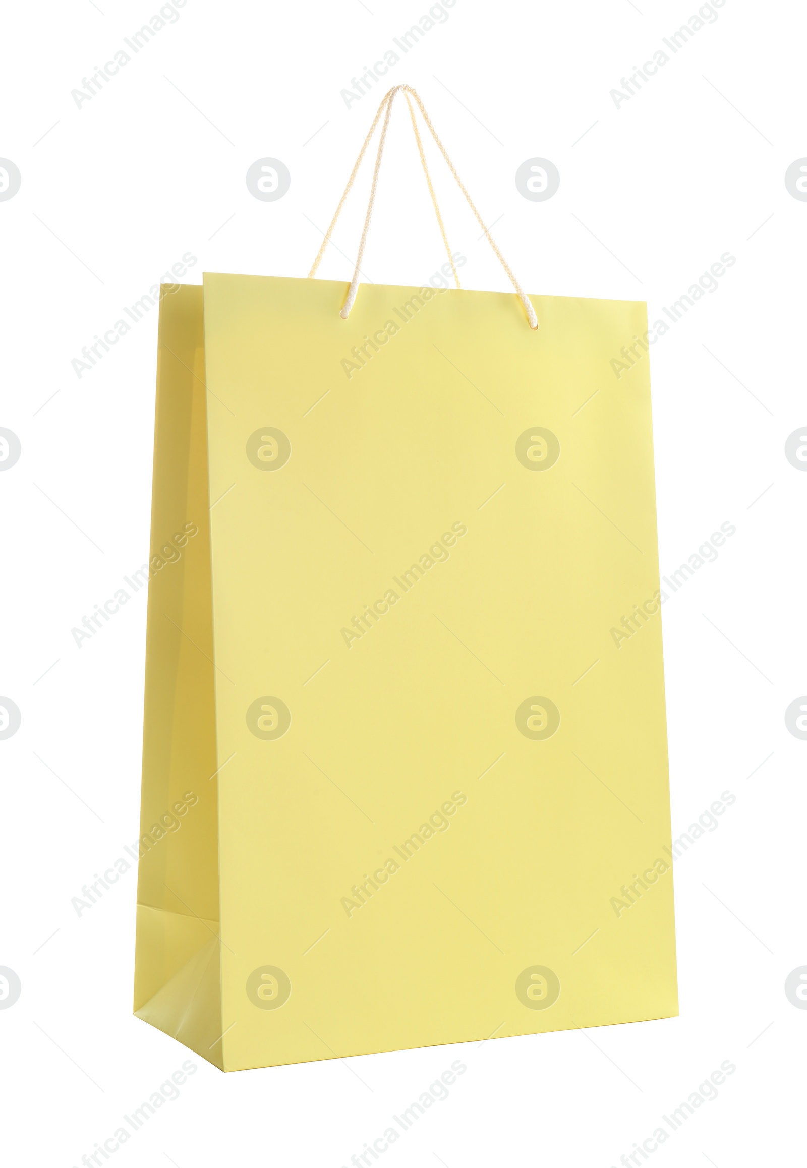 Photo of Yellow paper shopping bag isolated on white