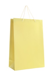 Yellow paper shopping bag isolated on white