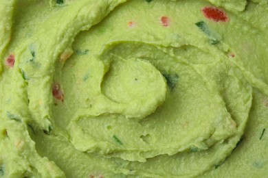 Photo of Delicious guacamole sauce as background, top view