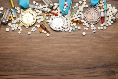 Photo of Flat lay composition with drugs on wooden table, space for text. Doping control