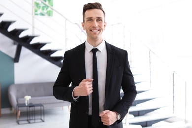 Male real estate agent indoors