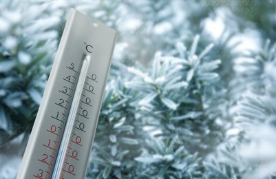 Thermometer showing temperature below zero outdoors on winter day