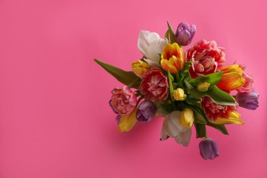 Photo of Bouquet of beautiful tulips on pink background, top view. Space for text