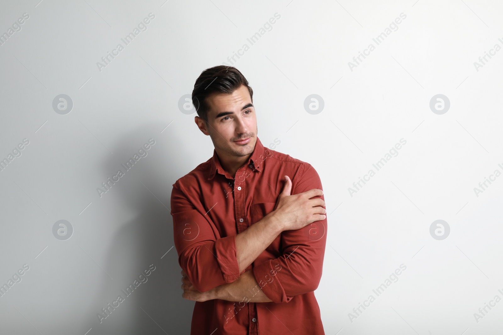 Photo of Portrait of handsome young man on white background