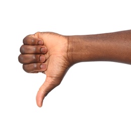 Photo of African-American man showing thumb down gesture on white background, closeup