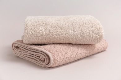 Photo of Soft bath towels on grey background