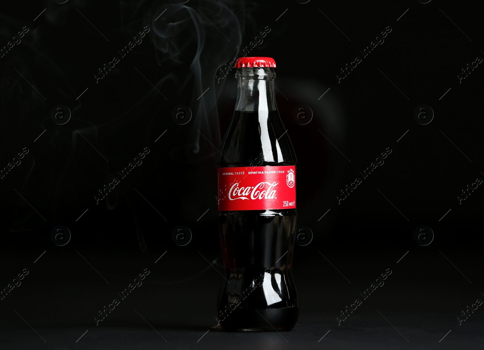 Photo of MYKOLAIV, UKRAINE - NOVEMBER 14, 2018: Bottle of Coca-Cola on dark background