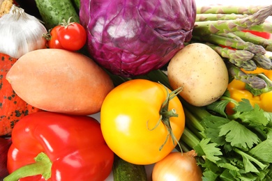 Many fresh ripe vegetables as background. Organic food