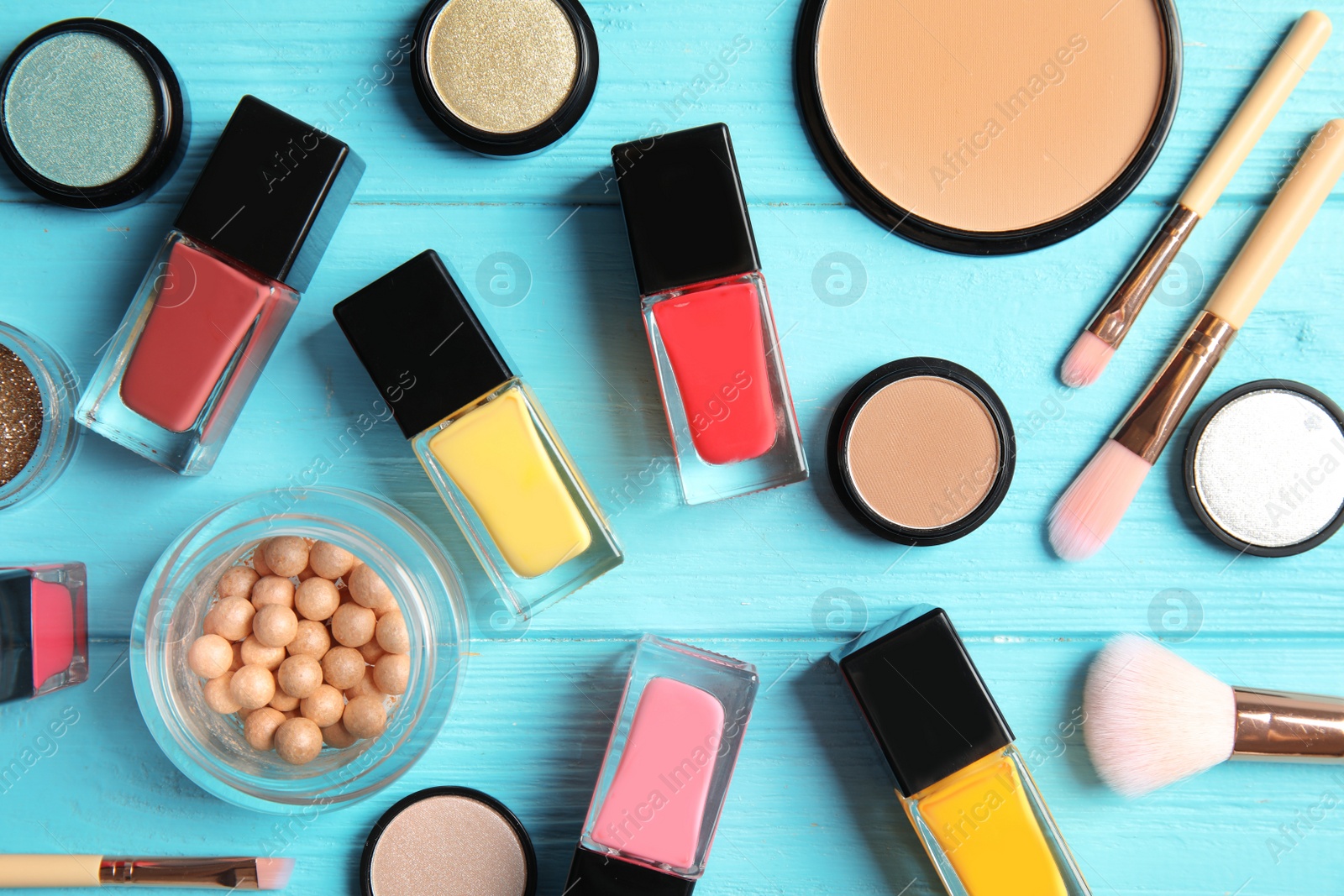 Photo of Flat lay composition with bottles of nail polish and different cosmetics on color background