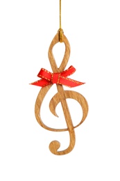 Wooden treble clef with red bow isolated on white. Christmas music concept