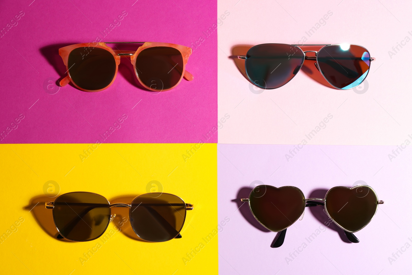 Photo of Stylish sunglasses on color background, flat lay. Summer time