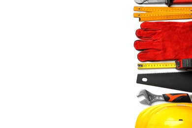 Composition with different construction tools on white background, top view