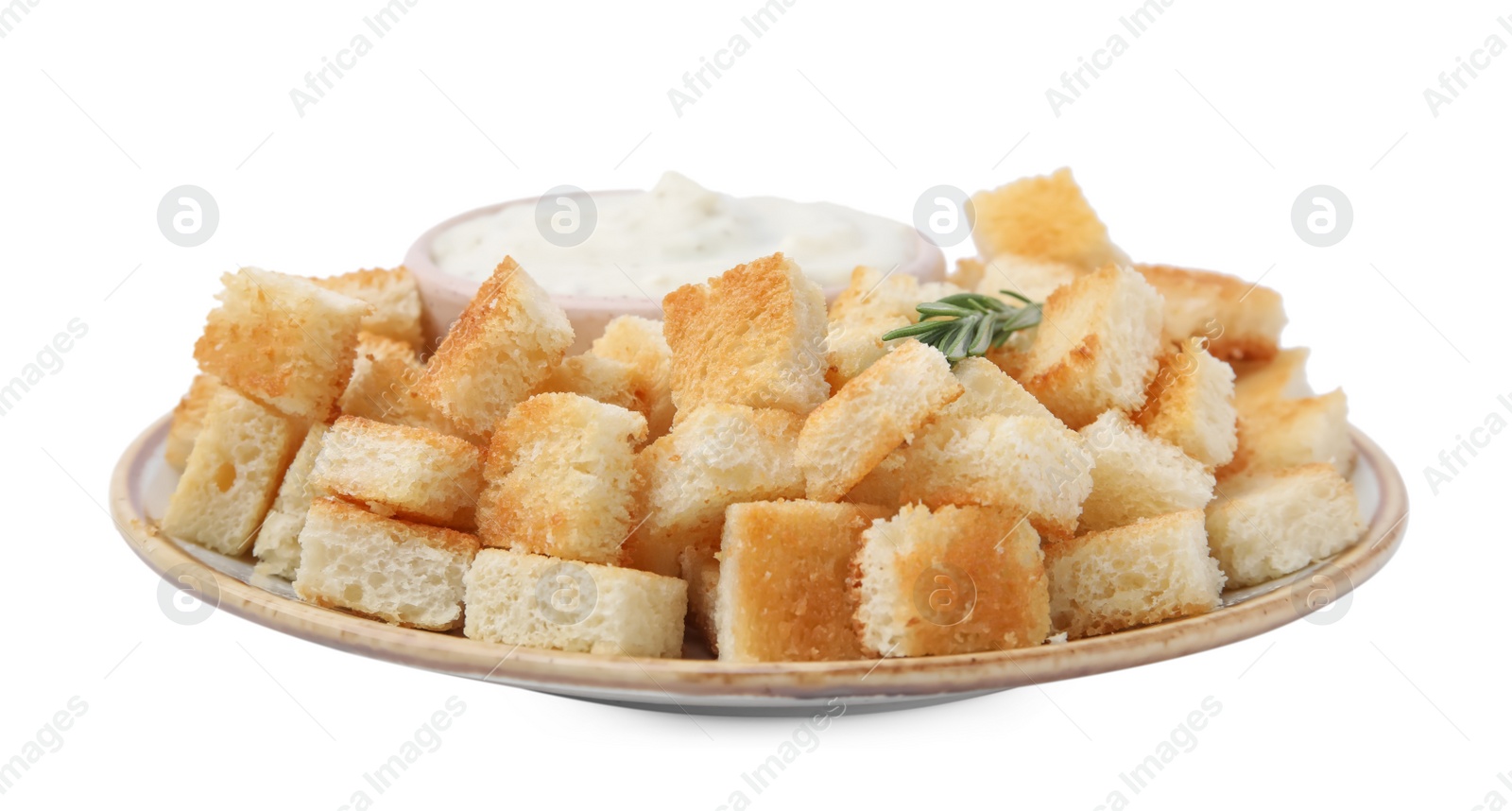 Photo of Delicious crispy croutons with rosemary and sauce on white background