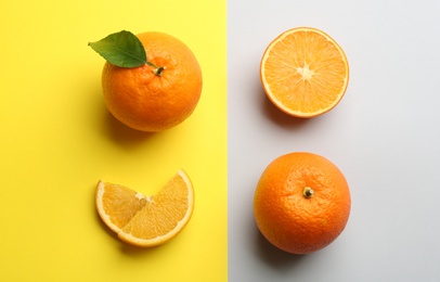 Delicious oranges on color background, flat lay