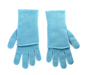 Photo of Stylish blue gloves on white background, top view. Autumn clothes