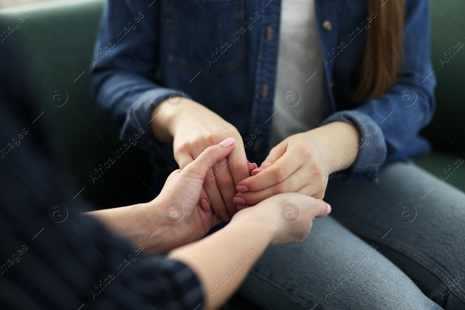 Photo of Psychotherapist working with patient in office, closeup