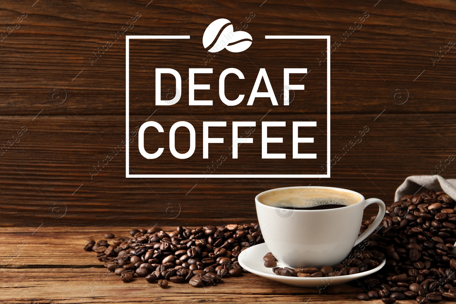 Image of Cup of aromatic decaf coffee and beans on wooden table