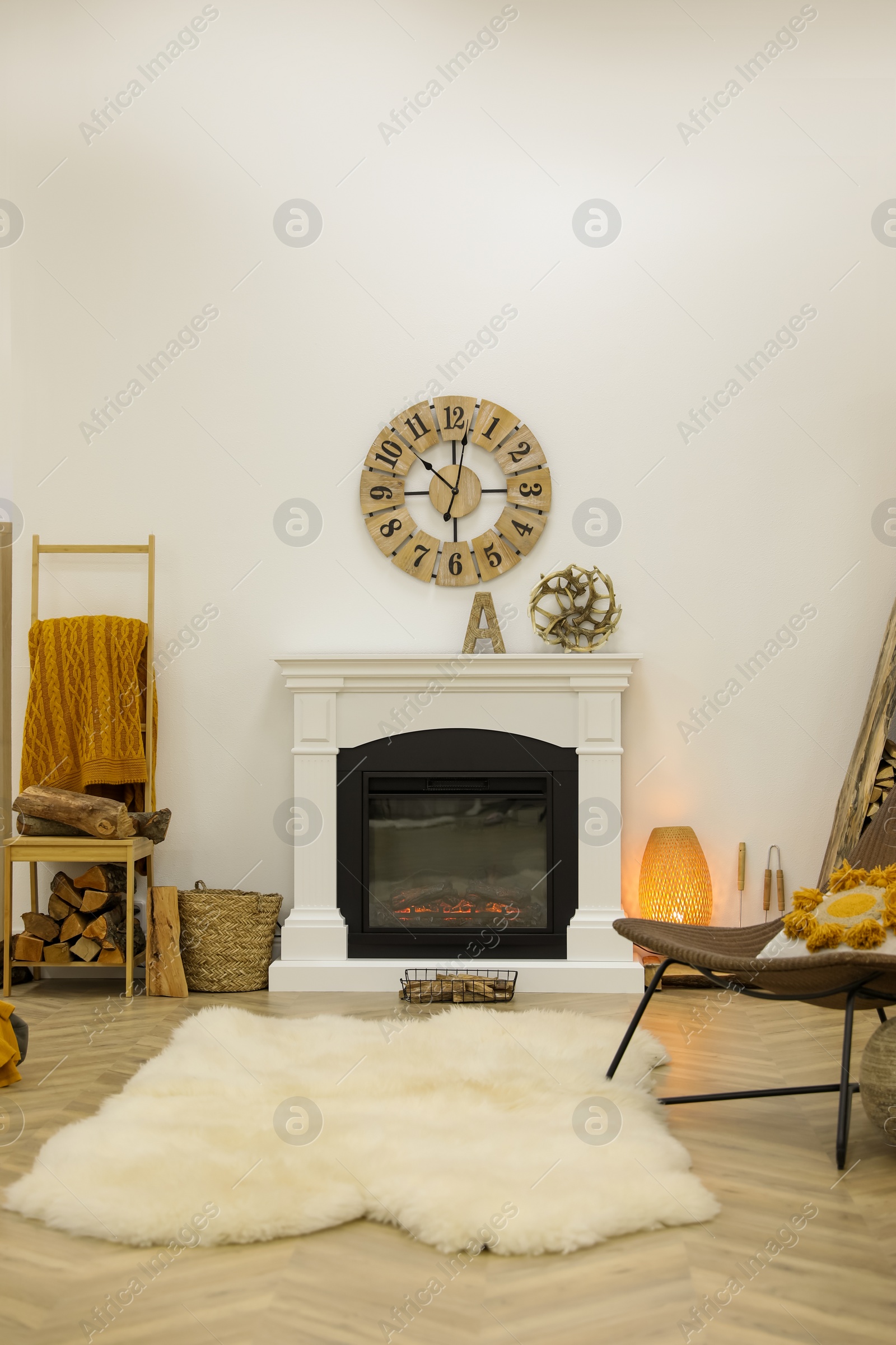 Photo of Elegant fireplace with burning flame in contemporary room interior