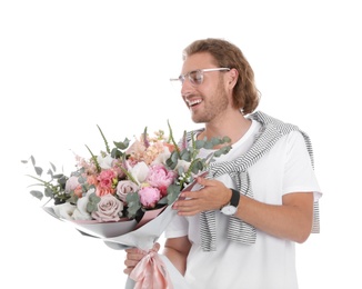 Young handsome man with beautiful flower bouquet on white background