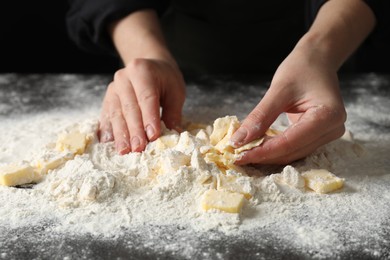 Photo of Woman making shortcrust pastry at table, closeup