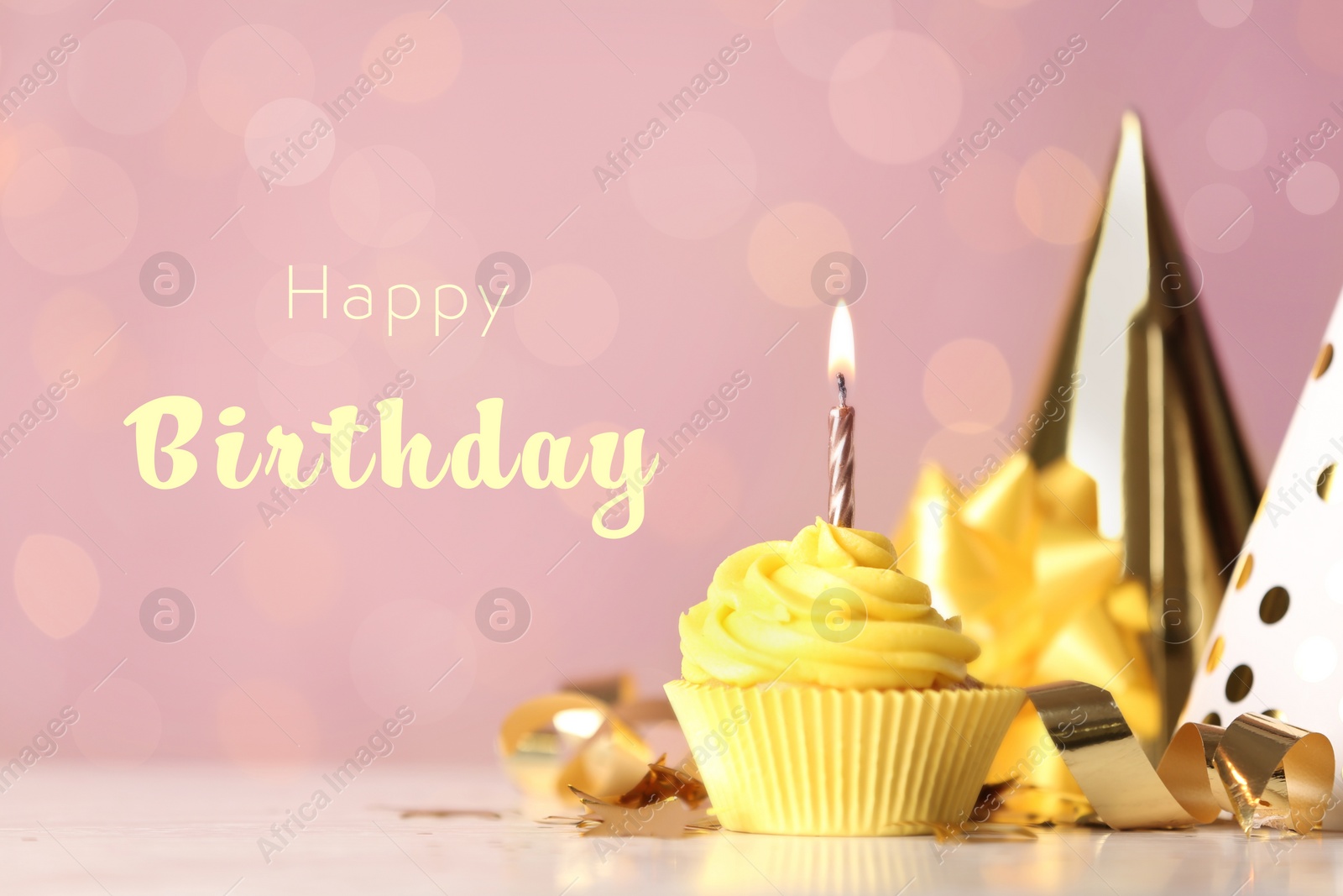 Image of Delicious cupcake with burning candle and text Happy birthday on blurred background