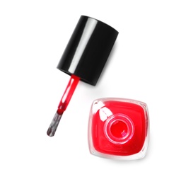 Photo of Bottle of color nail polish with brush on white background, top view