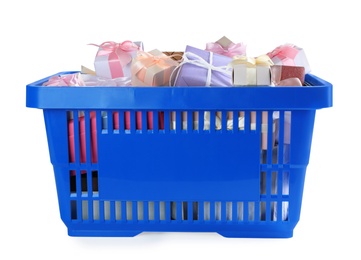 Photo of Blue shopping basket with different gifts on white background