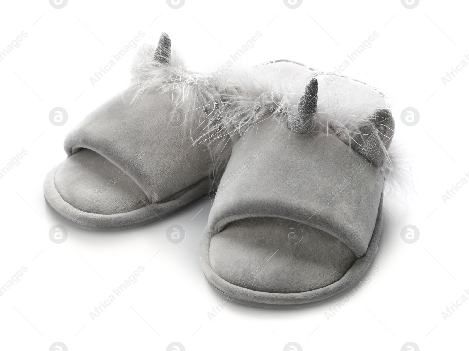 Photo of Pair of stylish soft slippers on white background