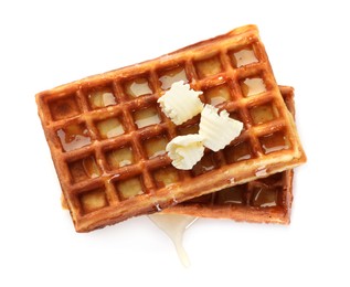 Photo of Delicious Belgian waffles with honey and butter on white background, top view