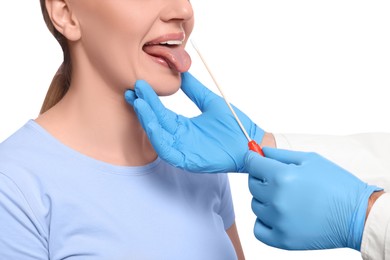 Doctor taking throat swab sample from woman`s oral cavity on white background, closeup