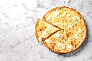 Delicious cheese pizza on marble background, top view