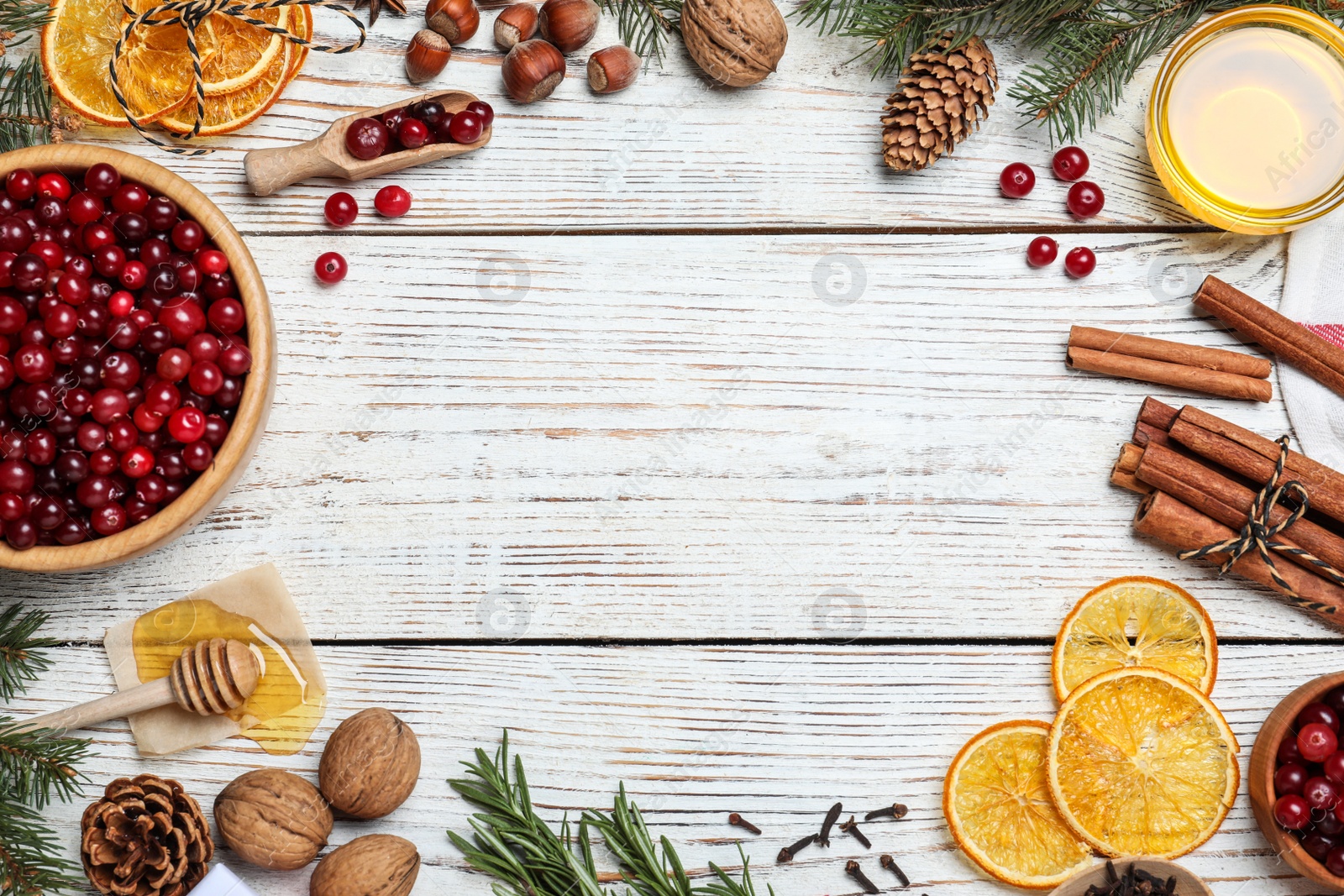 Photo of Flat lay composition with fresh ripe cranberries on white wooden table. Space for text