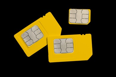 Photo of Different SIM cards on black background, flat lay