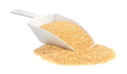 Photo of Pile of brown sugar and scoop isolated on white