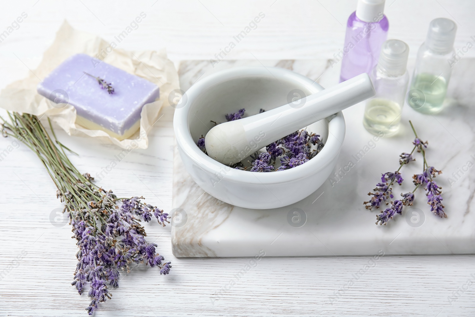 Photo of Composition with lavender flowers and natural cosmetic products on table