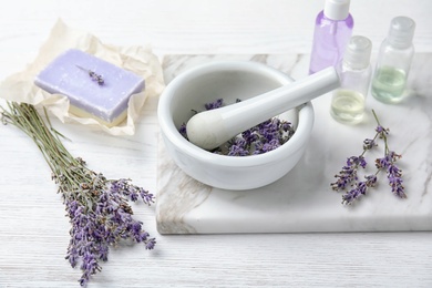 Composition with lavender flowers and natural cosmetic products on table