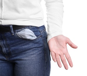 Photo of Poor woman showing empty pocket on white background, closeup