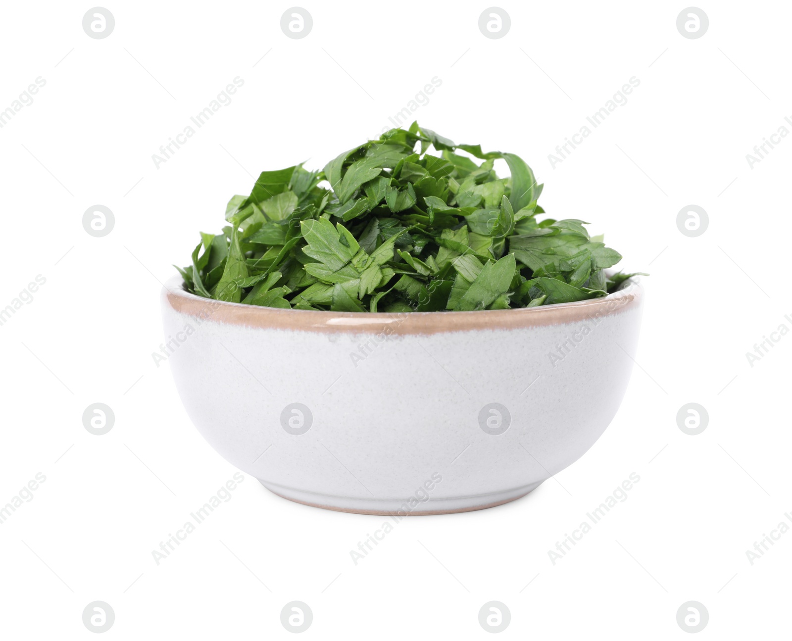 Chopped parsley leaves in bowl isolated on white Photo of Chopped parsley leaves in bowl isolated on white