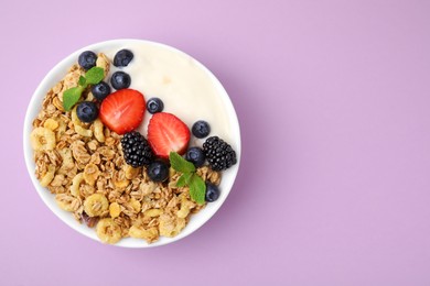Photo of Tasty oatmeal, yogurt and fresh berries in bowl on lilac background, top view with space for text. Healthy breakfast