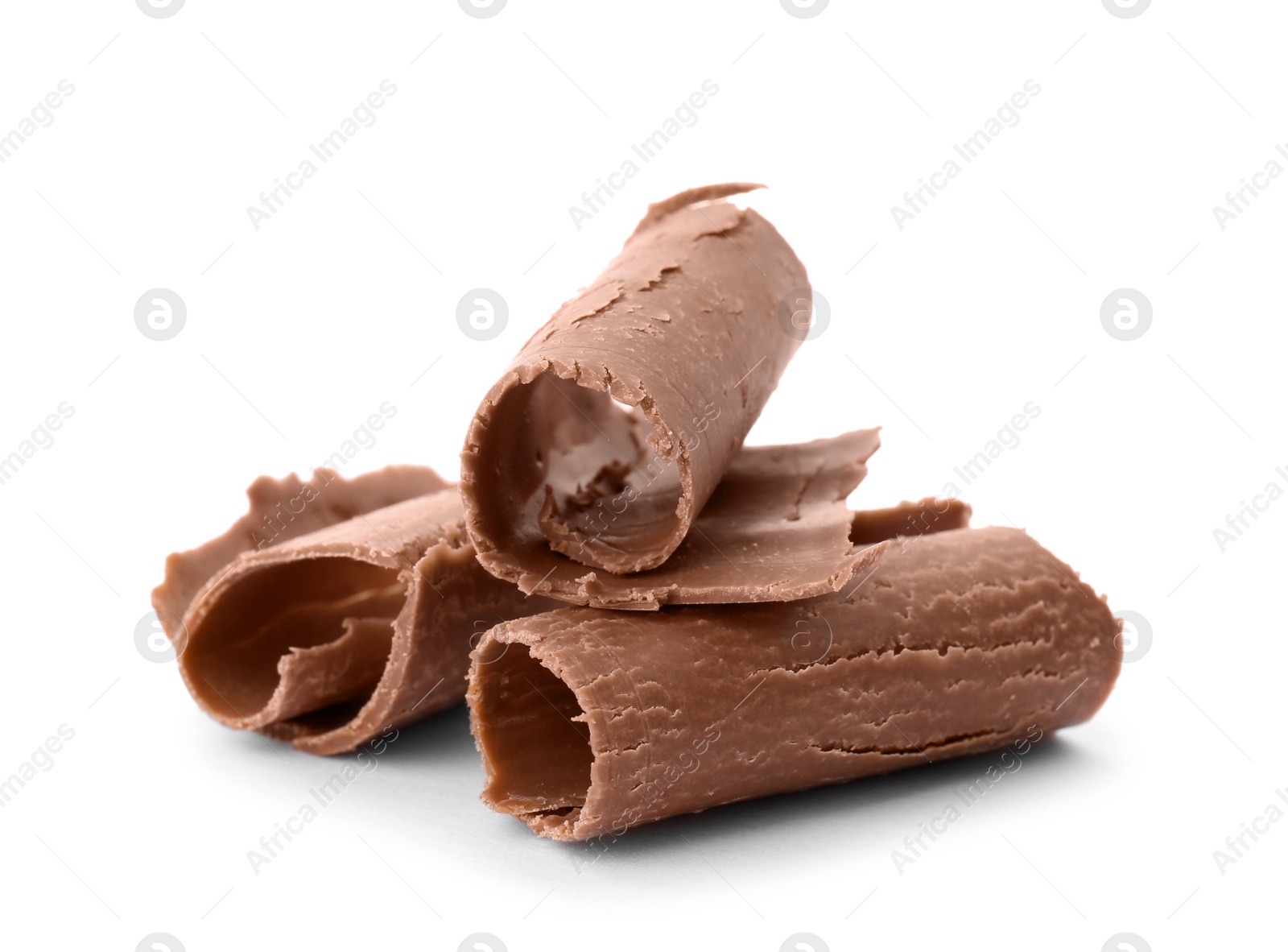 Photo of Delicious milk chocolate curls on white background