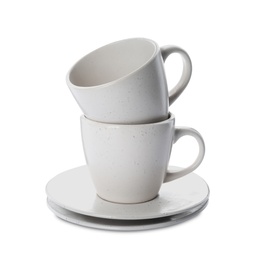 New clean ceramic cups and saucers on white background